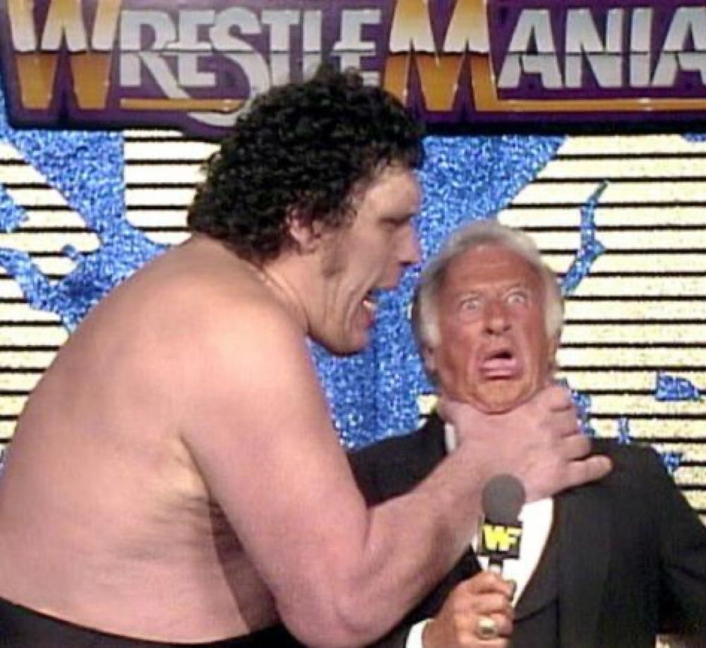 Andre The Giant choking Bob Uecker at WrestleMania IV