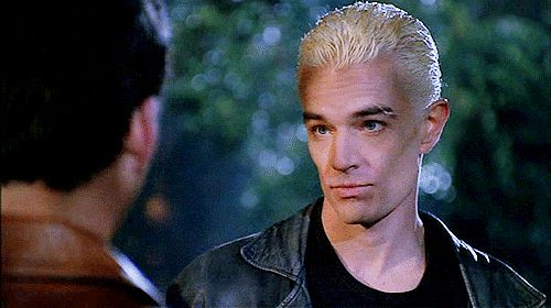 Spike from Buffy listening to someone who is facing away from the camera - he’s blinking and looks like he’s about to smirk and probably feed on the guy