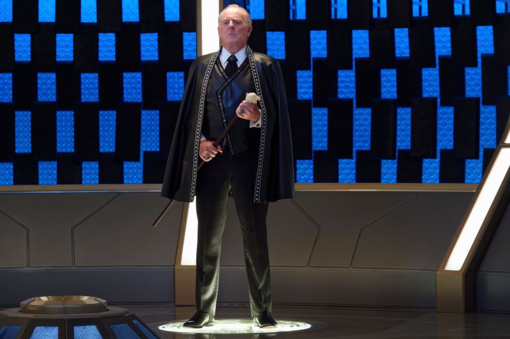 Peter MacNeill as Baron Grimes preparing to beam to his luxury starship, The Festoon.

Briefly appearing in "Magic to Make the Sanest Man Go Mad", Grimes' ship The Festoon was designed by Ryan Denning to be an "over-the-top, big, ridiculous super yacht".