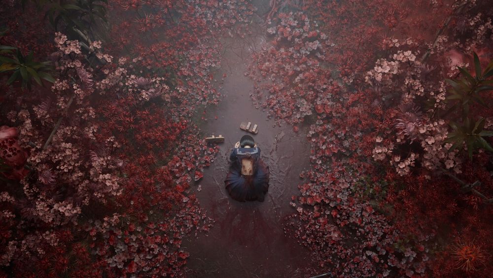 Screenshot from Silent Hill f trailer. A field of red floral growth with what looks like a river of blood and a woman crouched down