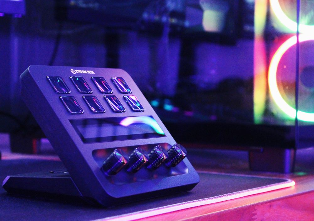 Aesthetic close up of Stream Deck + in glow of PC and blue lights 