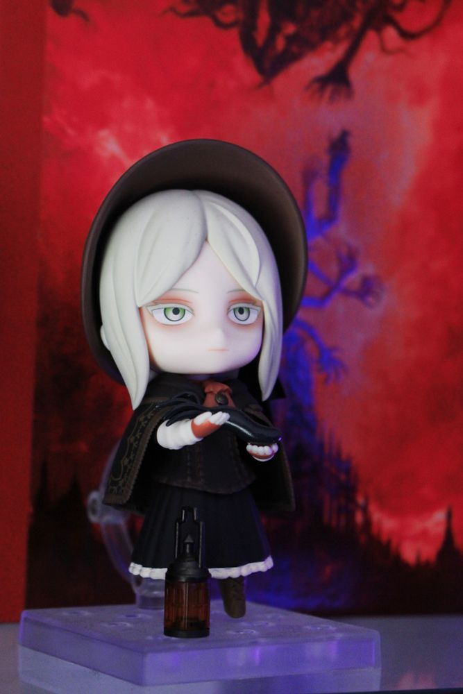Macro shot of my Nendoroid Bloodborne Doll. She's holding the Great One squid and has a lantern by her side.