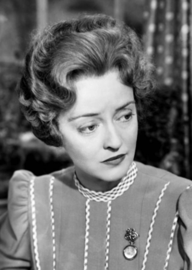 Bette Davis as Lily Moffatt (a teacher) in The Corn Is Green