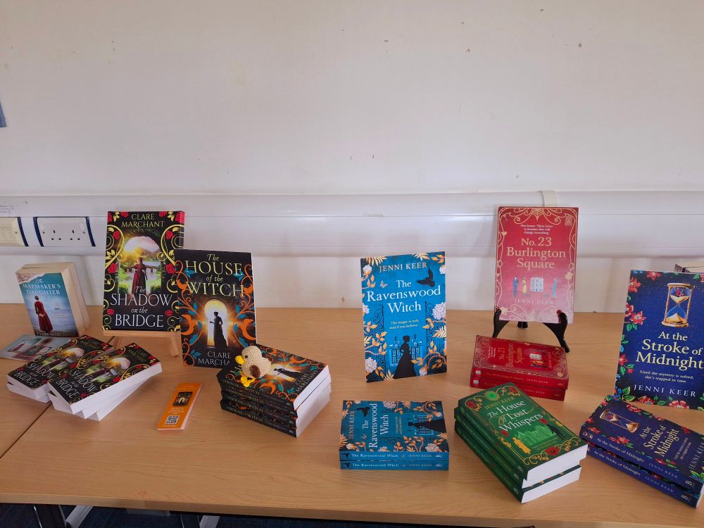 A selection of books by clare marchant and jenni keer on a table