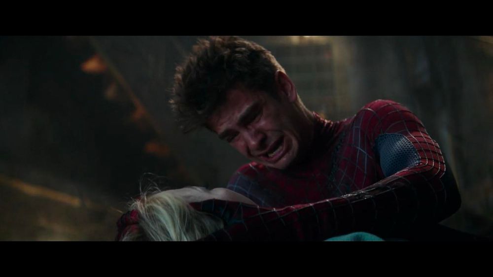 Screenshot of Andrew Garfield (as Spider-Man) holding Emma Stone’s head while crying from the iconic scene in The Amazing Spider-Man 2 