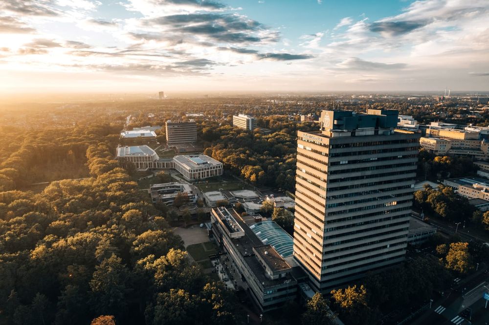 Aerial photograph of Radboud University campus with the Erasmus tower in the foreground: tallest building in Nijmegen & home to the Futures of Language project. Source: RU