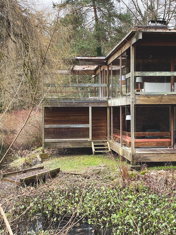 An architect designed house that looks a bit like a two story hunting cabin thrown together by a bunch of drinking buddies. 