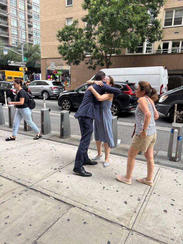 Assemblymember Alex Bores greeting constituents during the morning commute at subway stops.