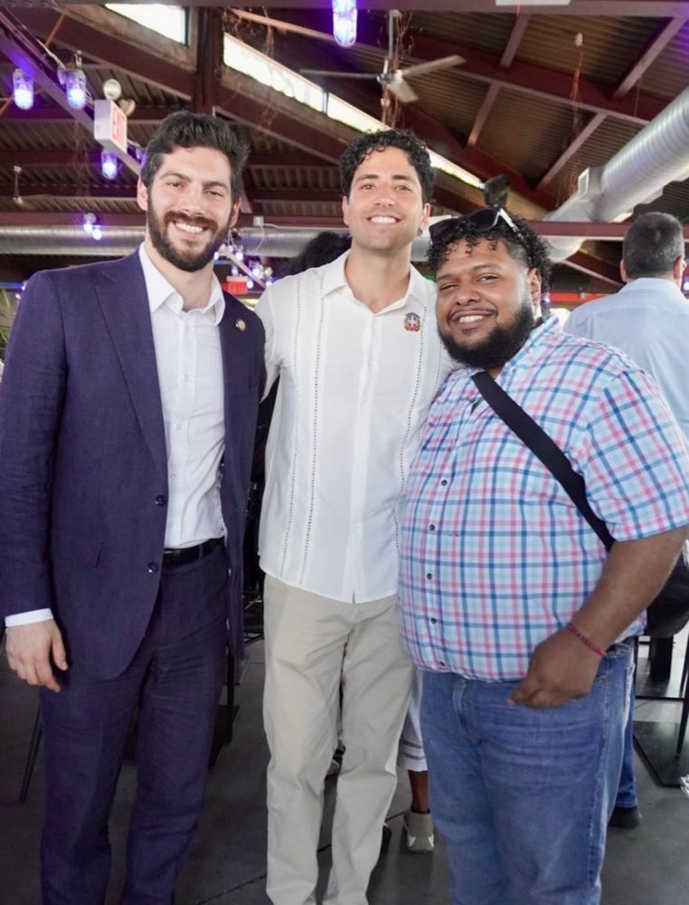 Assemblymember Alex Bores poses for a photo with Manny Rutinel