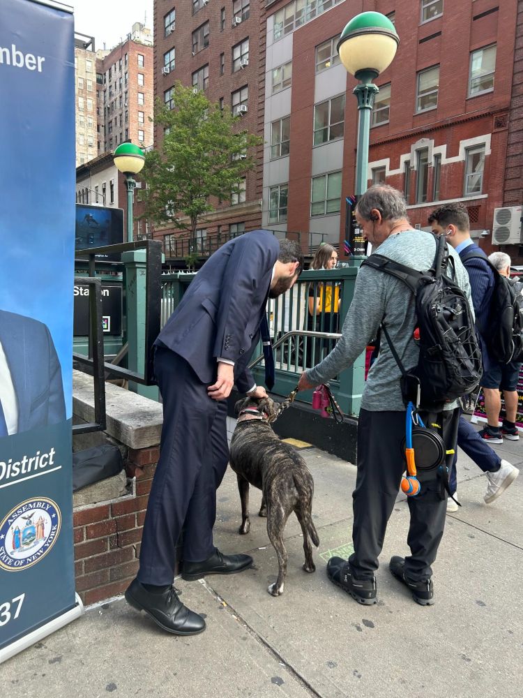 Assemblymember Alex Bores greeting constituents during the morning commute at subway stops.