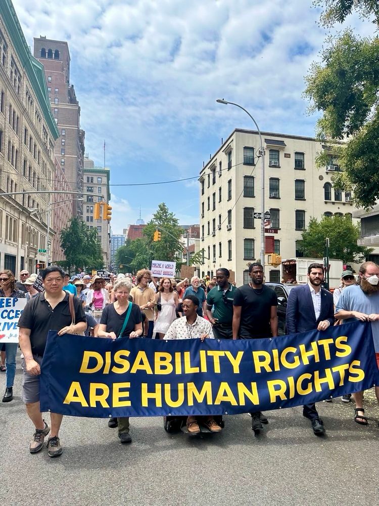 Assemblymember Alex Bores with the NYC Public Advocate at an ADA 35th anniversary protest, standing in solidarity with disability and labor advocates.