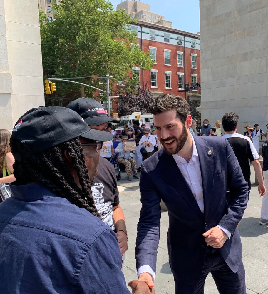 Assemblymember Alex Bores talks with advocates at an ADA 35th anniversary protest.