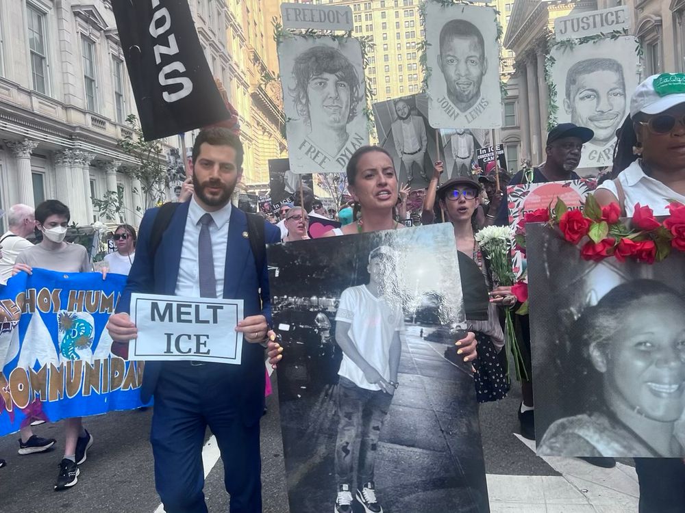 Alex, Catalina Cruz, and others march in the fifth anniversary of John Lewis' death.