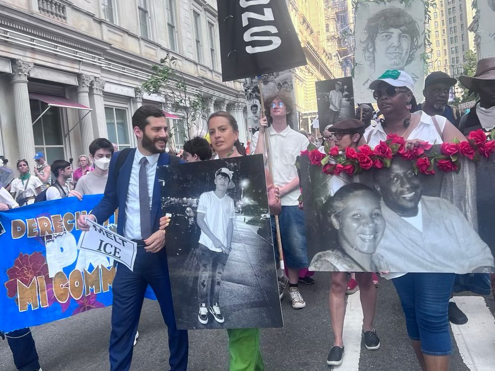 Alex, Catalina Cruz, and others march in the fifth anniversary of John Lewis' death.