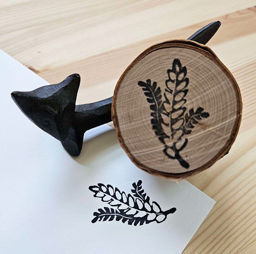 Same photo format as previous but the stamp is of a handful of fern leaves.