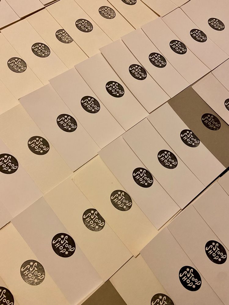Detail pic of backing boards stamped with stoop shop logo