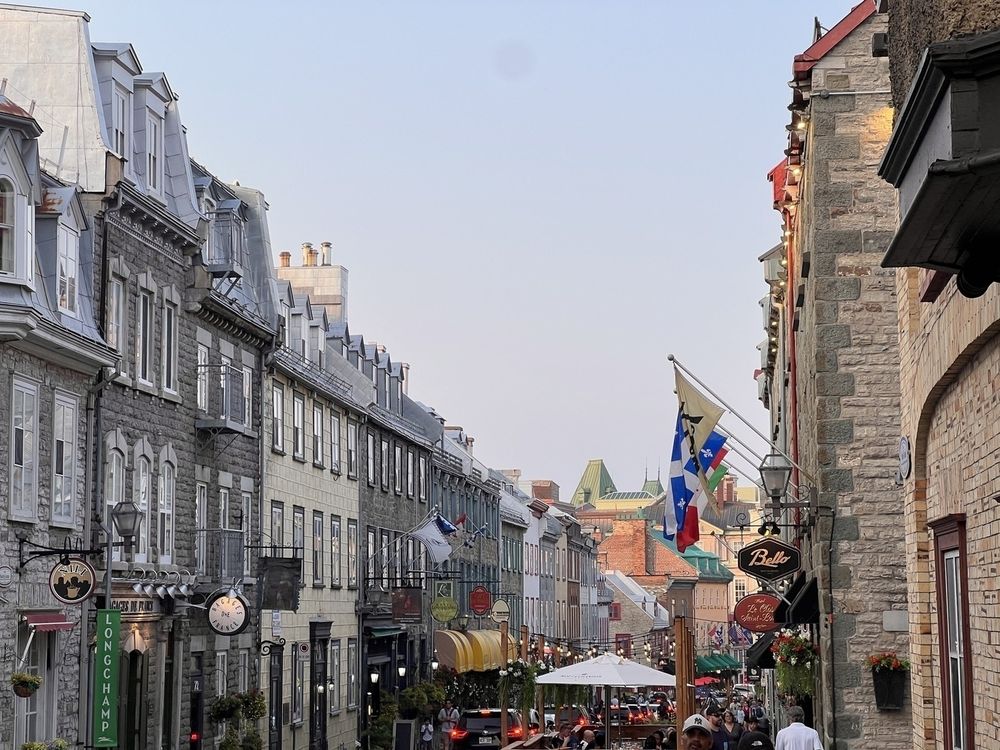 Long shot down the Rue Saint-Louis which looks very European