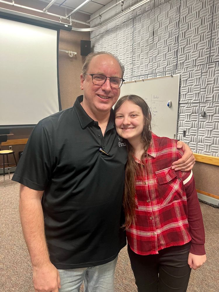 John Greco of GW Pens standing with his daughter Kai in one of the TV production rooms at Rowan University. 
