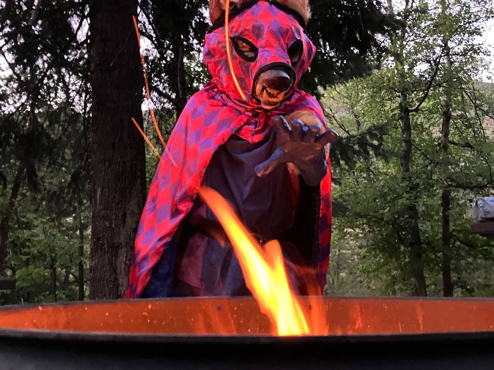 Slagar the Cruel with a handpaw out towards the fire. If it turns green, you're in trouble.