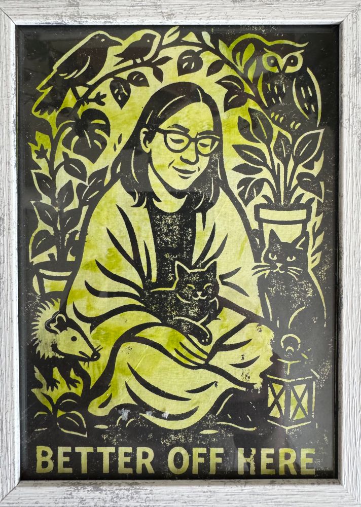 Mono print with two cats, a possum, crows, and an owl. It says “Better of here,” honoring a present and sacred space but also as a reminder of managing mental health. 