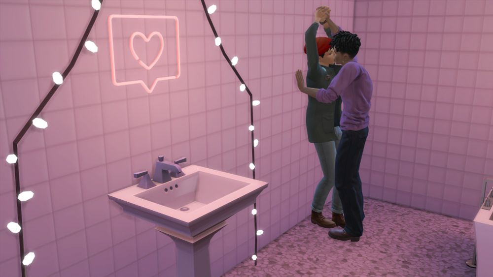 Sims making out against the wall in a rose-colored bathroom.