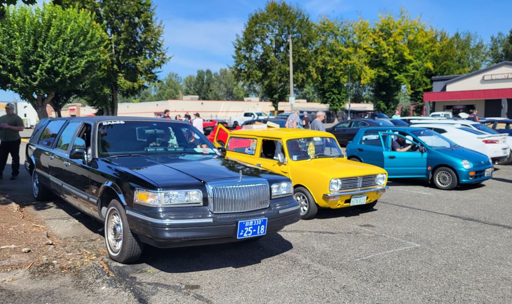 1997 JDM Lincoln Town Car Hearse, 1978 Leyland Mini van (NZ built), 1993 Honda Today