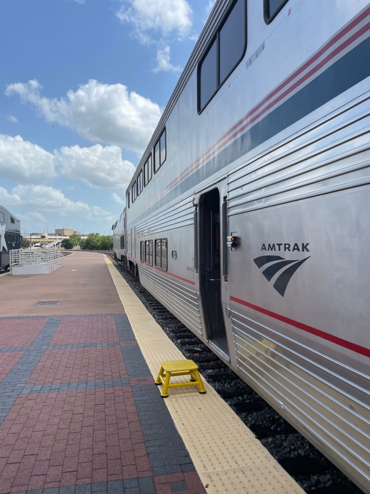 Open door and yellow stool to enter the train