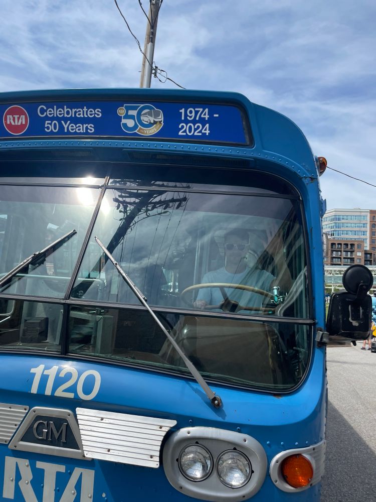 James waving from the driver’s seat of the RTA 50th bus 