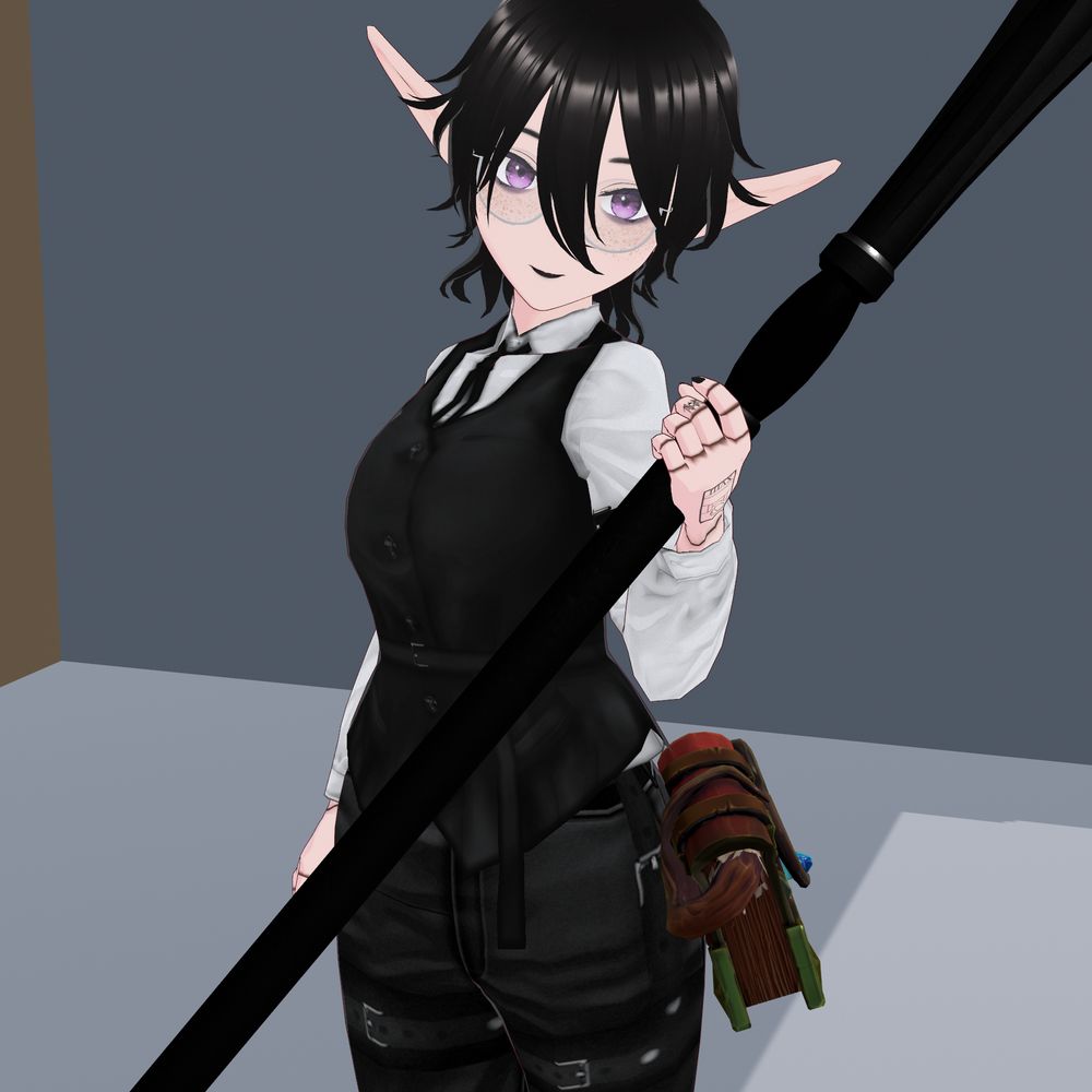 Mourn stands at an angle within her Atelier, holding a mage's staff in her left hand. The handle is black and shaped, extending out of the frame in both directions. She wears a pair of form-fitting jeans with belts and buckles across the thighs, reaching up to her belt-line. A book sits on her left hip, leatherbound with a blue crystal on the cover, and a woody tendril coming from the inner spine.