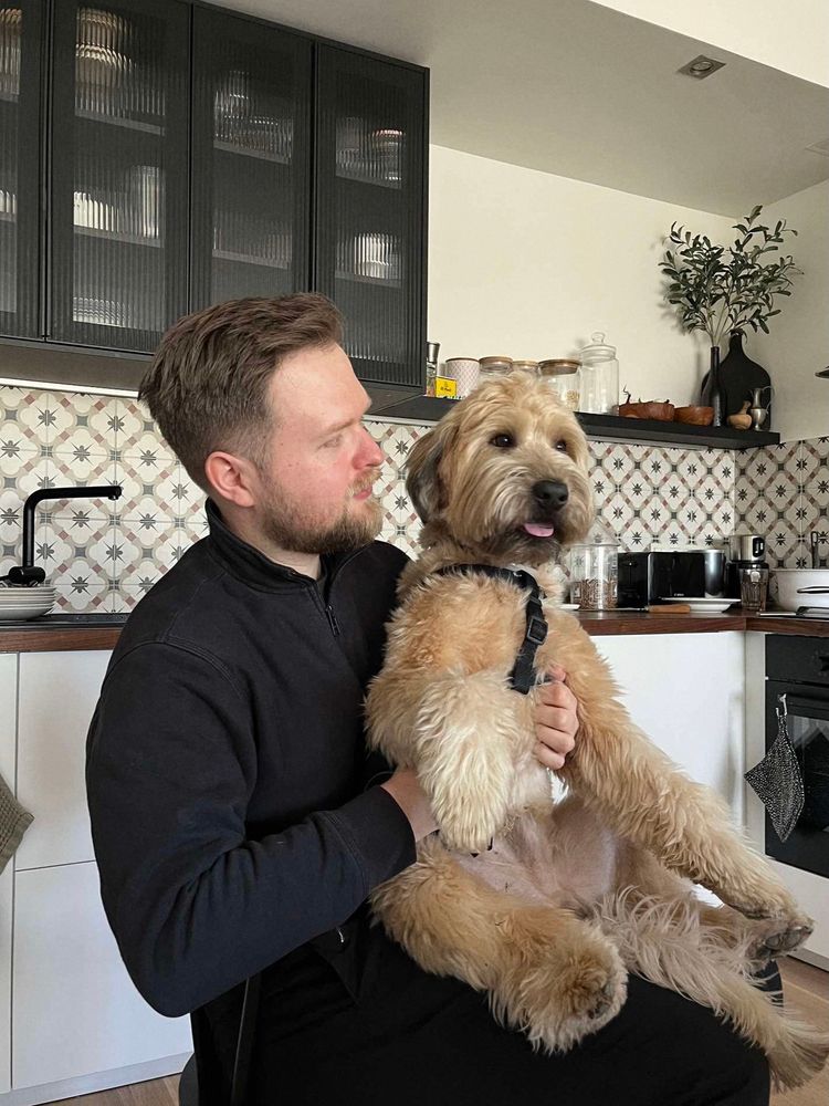 Me and my dog; who is perched up on my lap like a teddy bear 