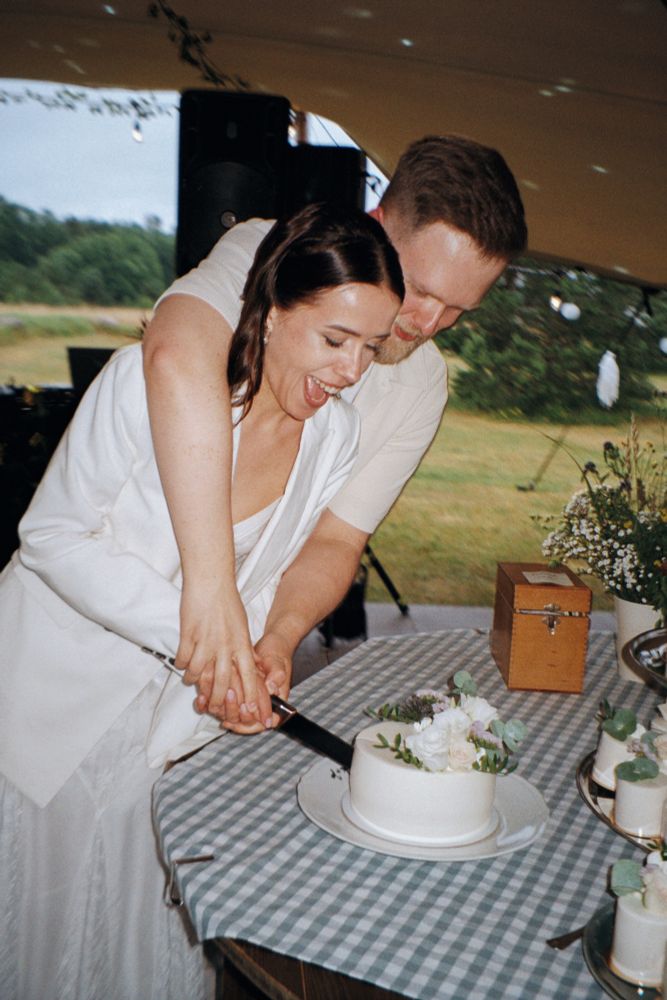 My wife and I cutting cake