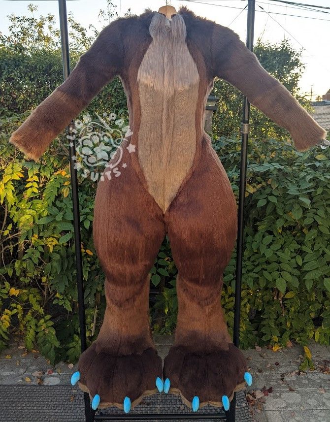 A canine fursuit displayed on a DTD in various browns and blue claws seen from the front.