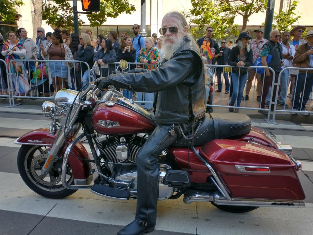 picture of me on red Harley mustered for the Pride parade 