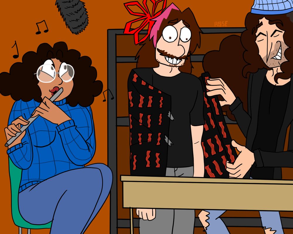 Vanessa playing a flute while Arin gets wrapped up in bacon wrapping paper by Dan.