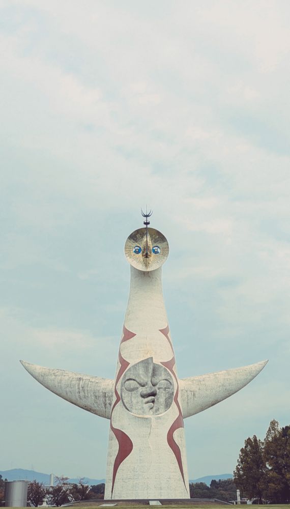 A portrait-orientation image of Tower of the Sun by Tarō Okamoto at Expo '70 Commemorative Park, Osaka