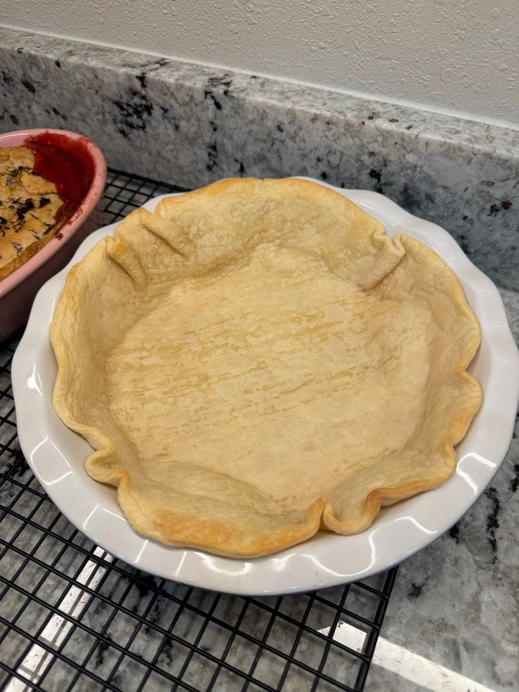 Par baked pie crust, ready for pumpkin pie filling.