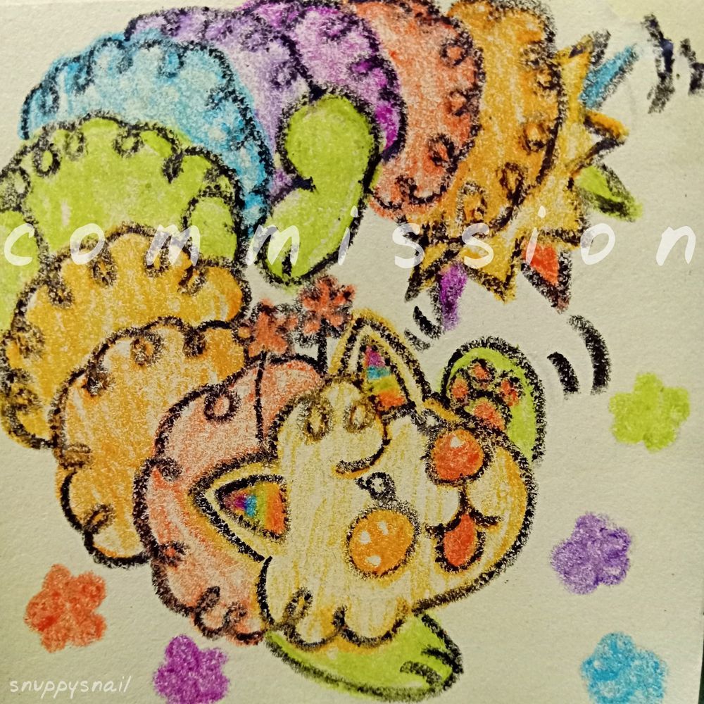 a rainbow coloured caterpillar cat critter, she's playing with her own tail how cute!