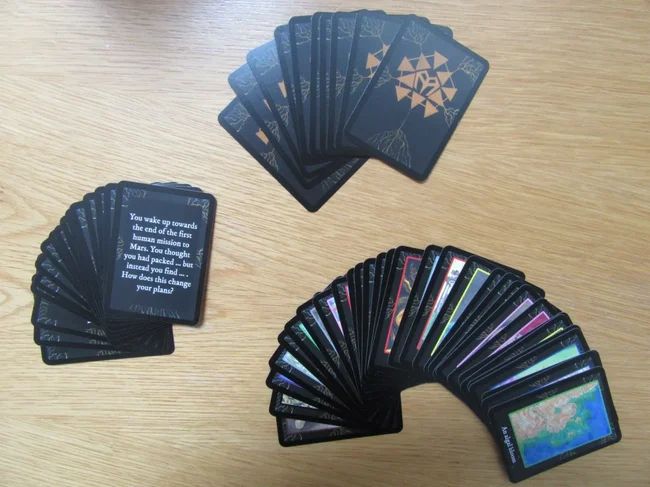a deck of illustrated Mycelium playing cards fanned out on a table