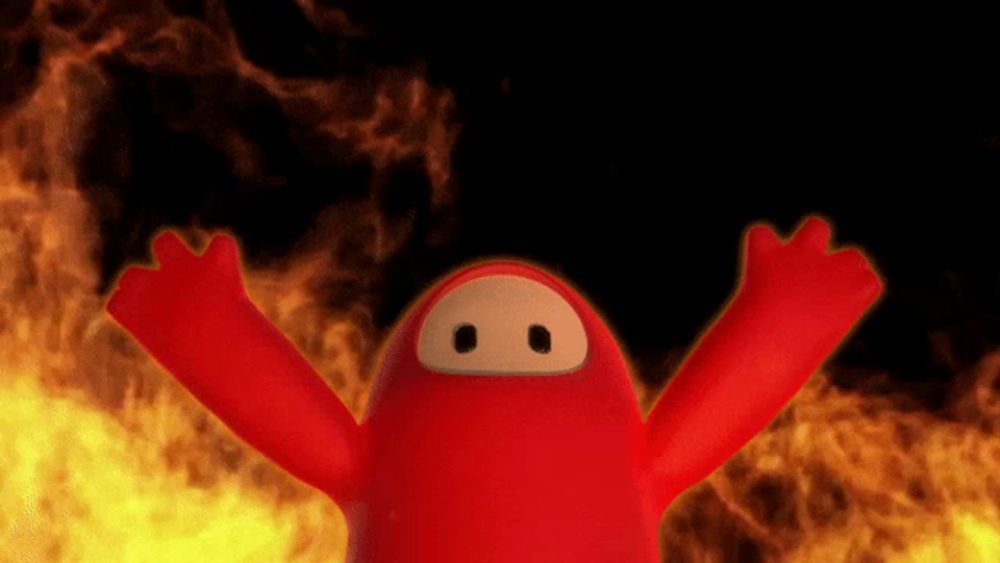 a red cartoon character with its arms outstretched in front of a fire background