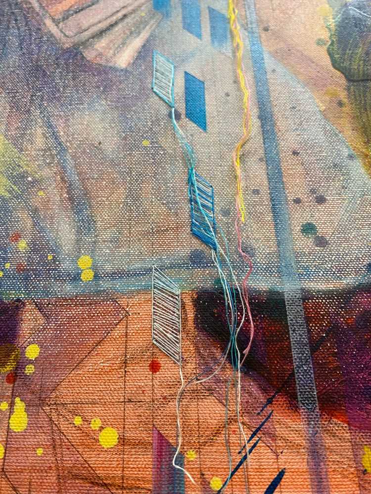 Closeup of a painting with an overlayed,  partially embroidered pattern.