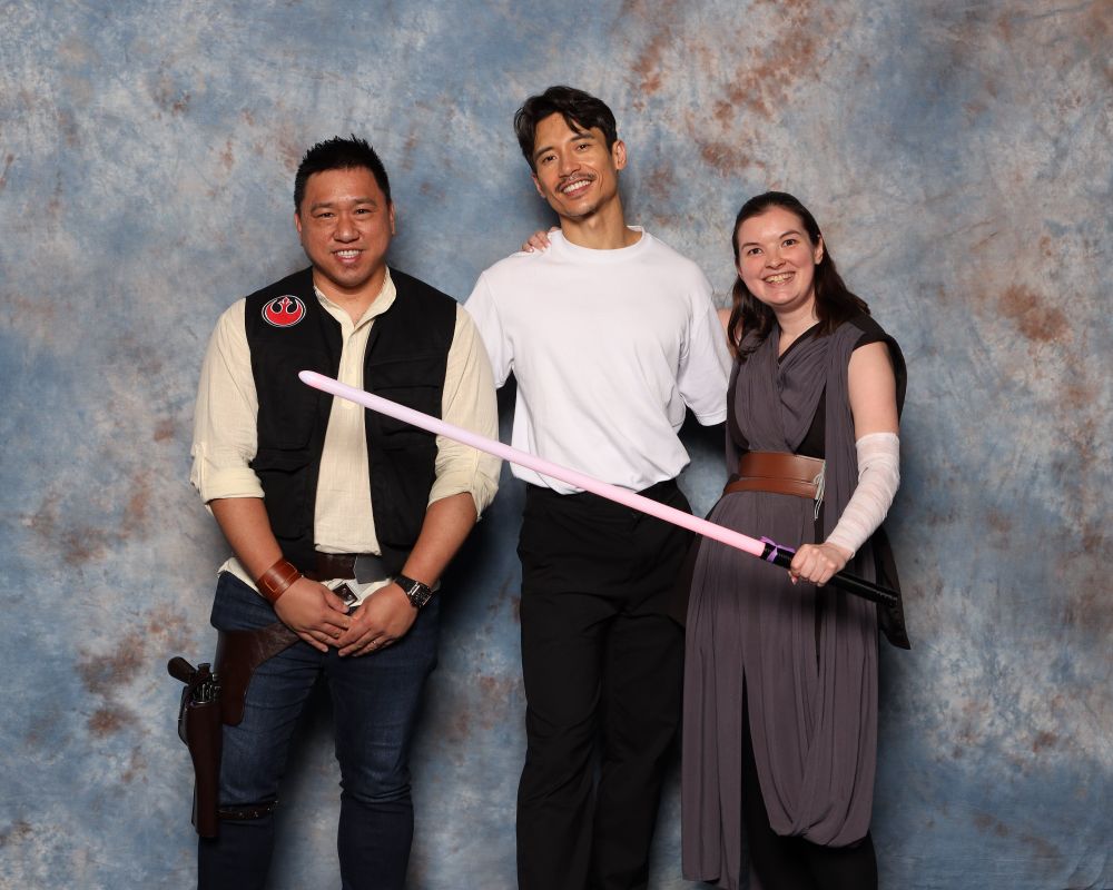 My husband and I taking a picture with Manny Jacinto, Qimir himself, this year at FanExpo Chicago.