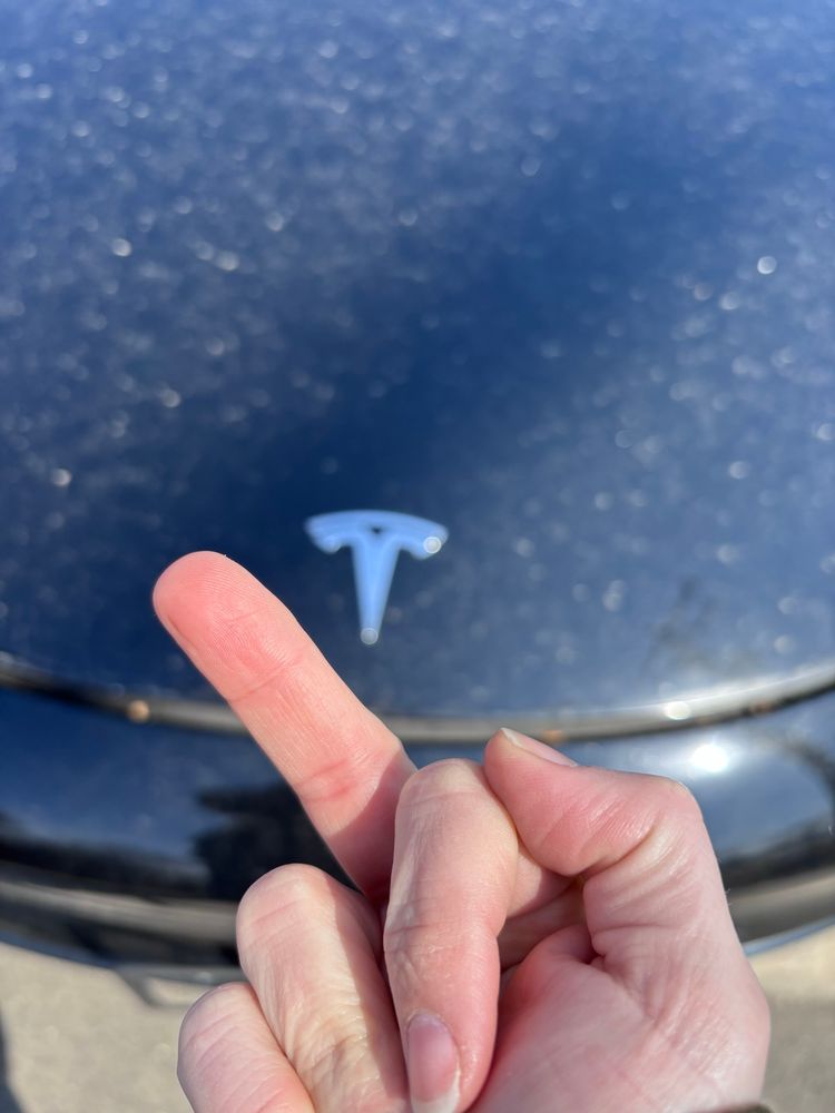Me flipping the bird to a very dirty model 3 that I used to own
