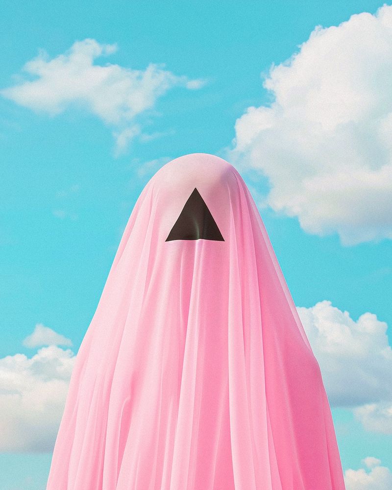 A shrouded person wearing a pink veil with an ominous black triangle cut out over their face, set against a serene blue sky with white clouds.