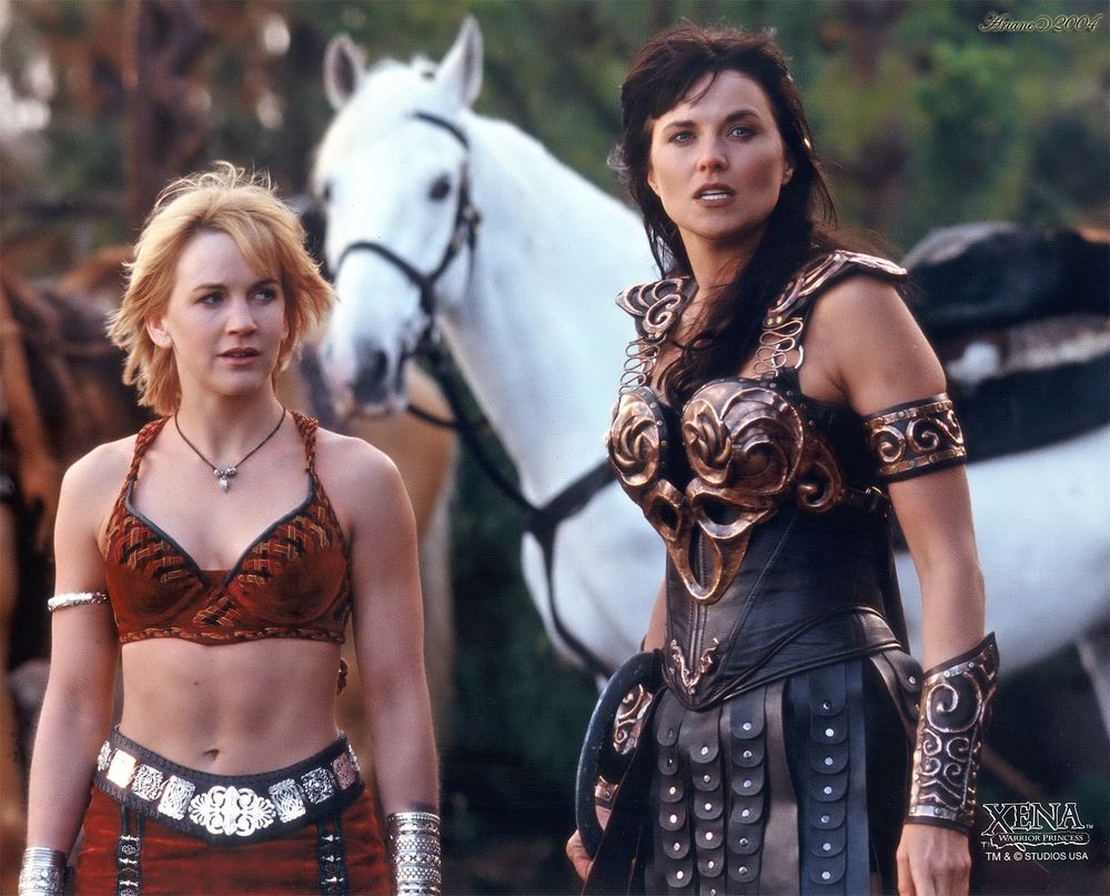 Gabrielle (L) in a red bra and skort and Xena (R) in her leather armor/skort.