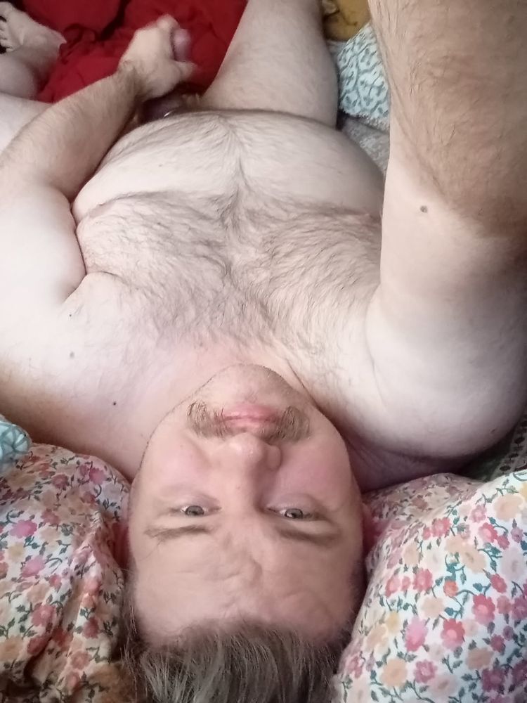 Man laying in bed masturbating 