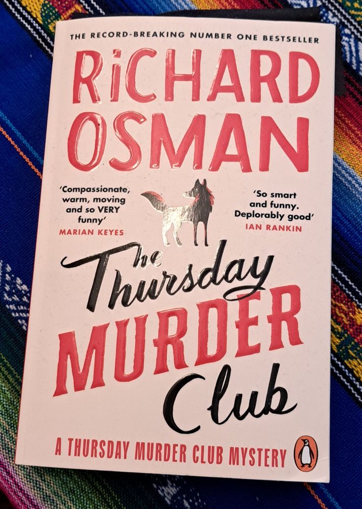 A copy of "The Thursday Murder Club"   by Richard Osman.