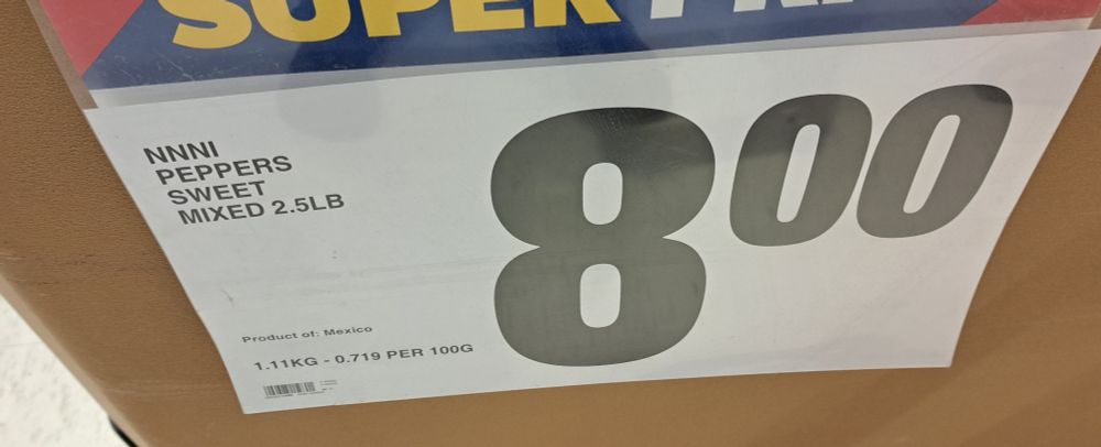 Grocery store sign which reads:

NNNI
PEPPERS
SWEET
MIXED 2.5L 
$8.00

where NNNI == No Name® "Naturally Imperfect".