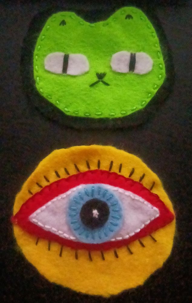 A green cat and a yellow/red/blue eye flet patch. The patterns are ones I found online. 