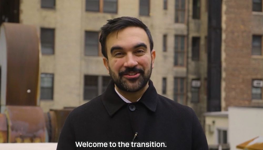 Zohran Mamdani looking at the viewer. He says: "Welcome to the transition."