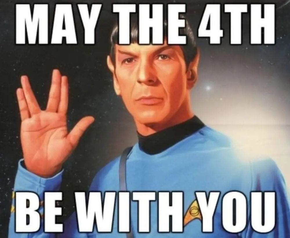 A meme featuring Spock from Star Trek, dressed in a blue uniform and giving the Vulcan salute, with bold white text over the image that reads “MAY THE 4TH BE WITH YOU"